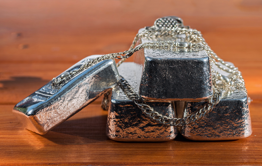 bigstock Cast Silver Bars And Silver Je 263495470